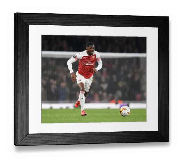 Framed Print : Arsenal's Ainsley Maitland-Niles Faces Off Against S.S.C. Napoli in Europa League Quarterfinals