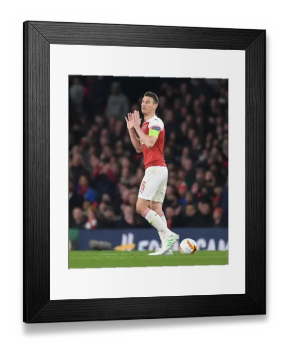 Framed Print : Arsenal vs. S.S.C. Napoli: Laurent Koscielny in Europa League Quarterfinal Action at Emirates Stadium Framed Print : Arsenal vs. S.S.C. Napoli: Laurent Koscielny in Europa League Quarterfinal Action at Emirates Stadium
