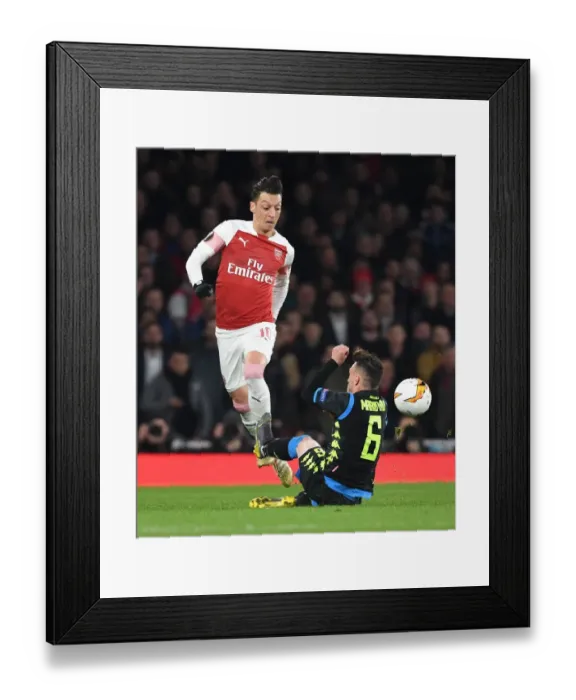 Framed Print : Arsenal vs. Napoli: Ozil Clashes with Rui in Europa League Quarterfinal Framed Print : Arsenal vs. Napoli: Ozil Clashes with Rui in Europa League Quarterfinal