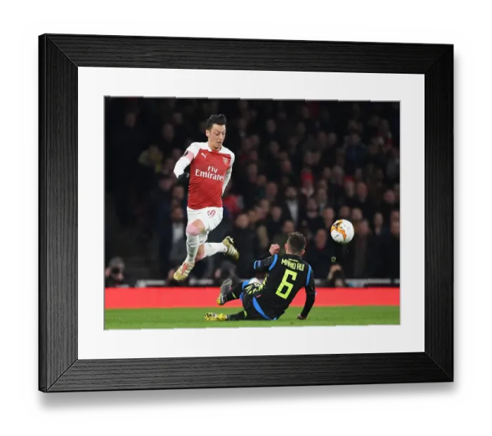 Framed Print : Arsenal vs. Napoli: Mesut Ozil Clashes with Mario Rui in Europa League Quarterfinal