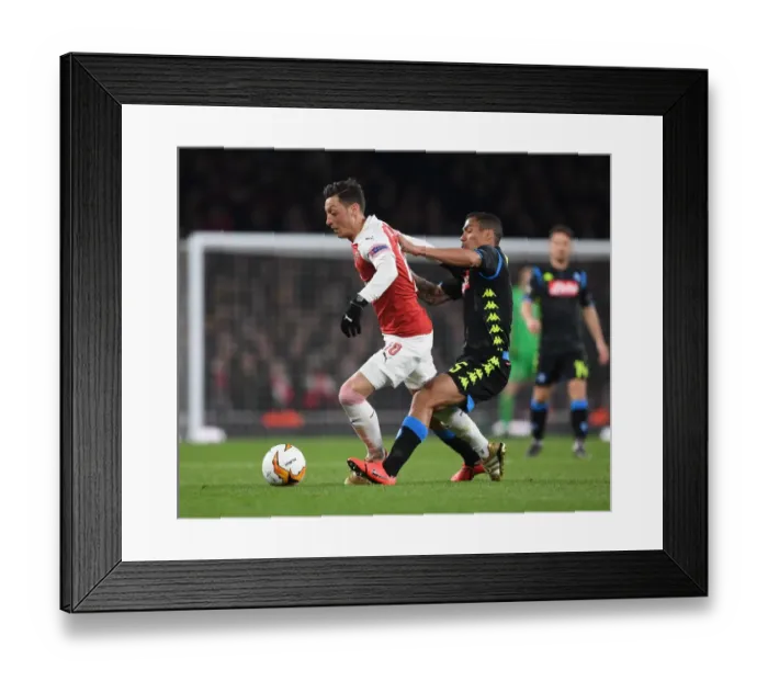 Framed Print : Mesut Ozil's Magic: Outsmarting Napoli's Allan in Arsenal's Europa League Victory Framed Print : Mesut Ozil's Magic: Outsmarting Napoli's Allan in Arsenal's Europa League Victory