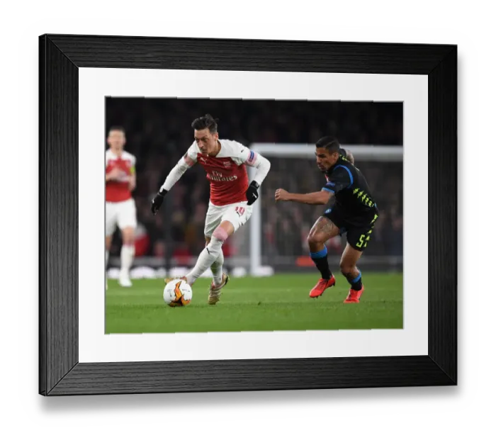 Framed Print : Mesut Ozil's Magic: Outsmarting Napoli's Allan in Arsenal's Europa League Victory