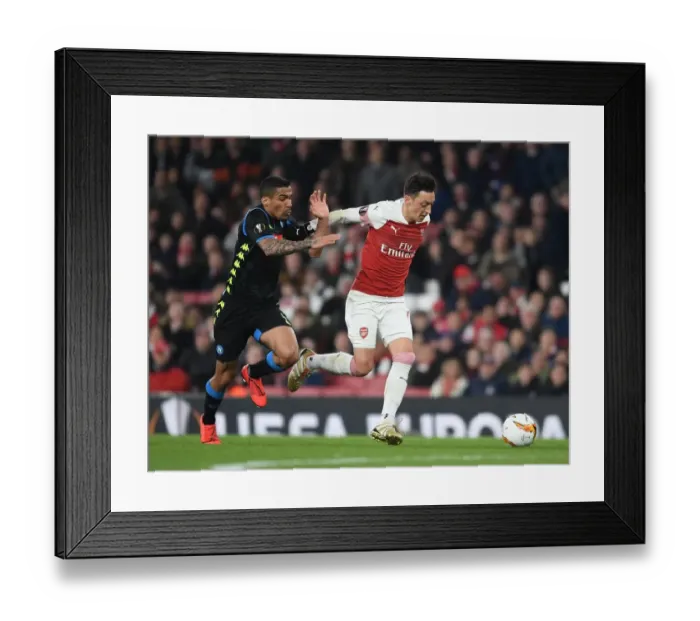 Framed Print : Ozil vs. Allan: A Europa League Battle at the Emirates Framed Print : Ozil vs. Allan: A Europa League Battle at the Emirates
