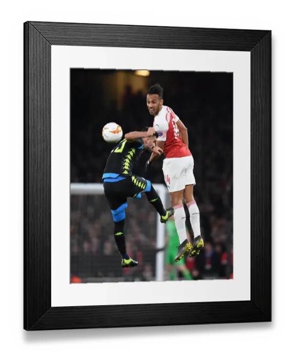 Framed Print : Arsenal's Aubameyang Leaps Past Napoli's Hysaj in Europa League Quarterfinal Clash Framed Print : Arsenal's Aubameyang Leaps Past Napoli's Hysaj in Europa League Quarterfinal Clash