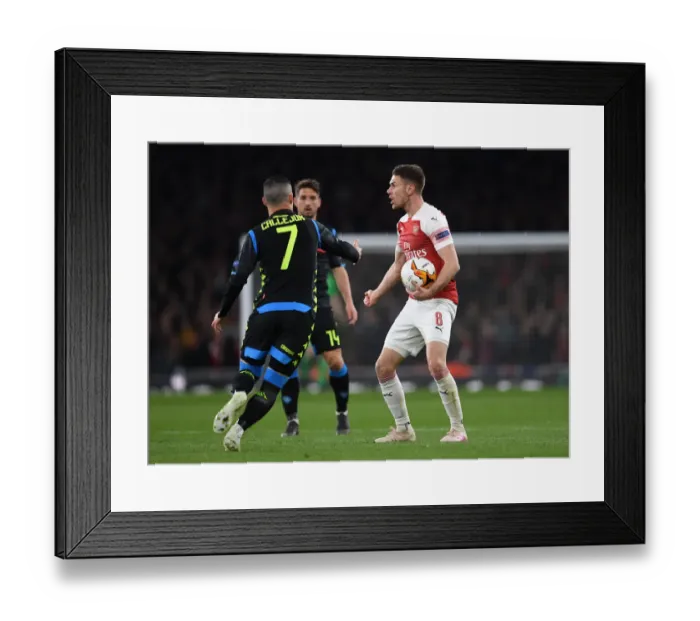 Framed Print : Arsenal vs. S.S.C. Napoli: Aaron Ramsey in Europa League Quarterfinal Action at Emirates Stadium