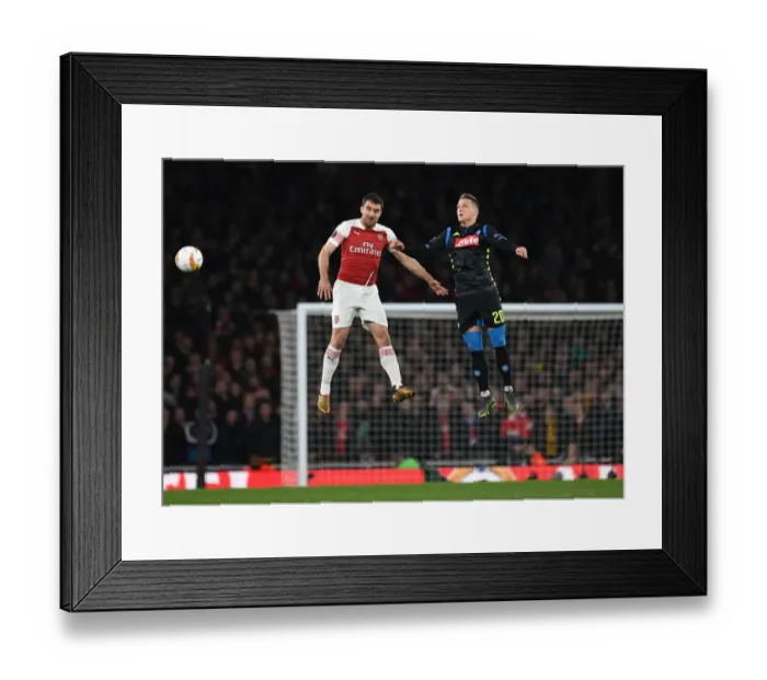 Framed Print : Arsenal's Sokratis Denies Zielinski in Europa League Quarterfinal Showdown