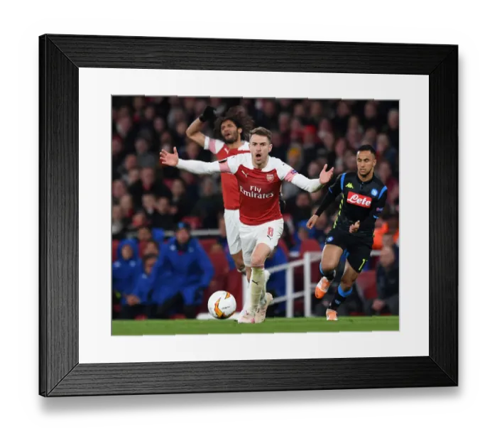 Framed Print : Arsenal's Aaron Ramsey: Unyielding Determination in Europa League Battle Against Napoli