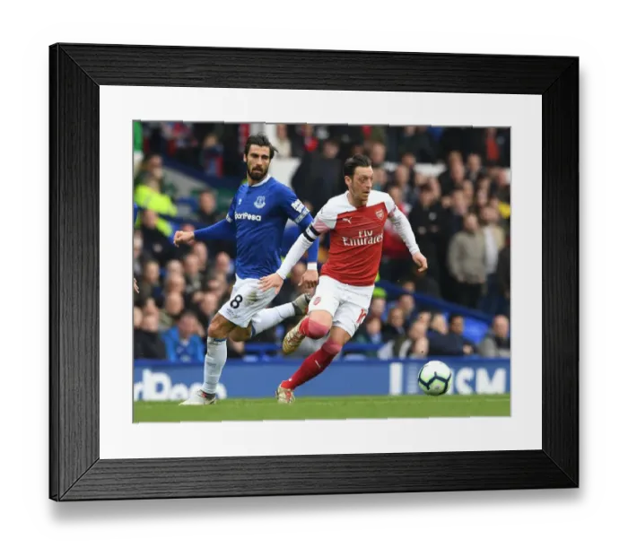 Framed Print : Mesut Ozil vs. Andre Gomes: A Premier League Showdown at Goodison Park