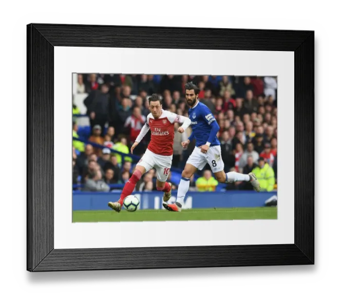 Framed Print : Mesut Ozil vs. Andre Gomes: A Midfield Duel at Goodison Park - Arsenal vs. Everton, Premier League 2018-19
