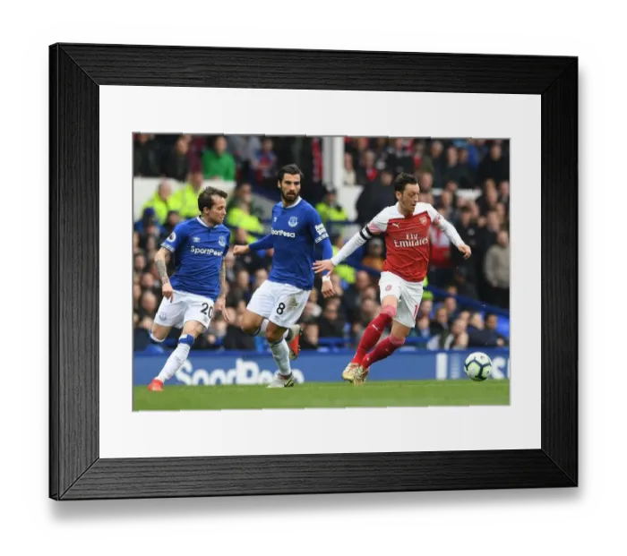 Framed Print : Mesut Ozil vs. Andre Gomes & Bernard: Intense Rivalry Unfolds in Everton vs. Arsenal Premier League Clash Framed Print : Mesut Ozil vs. Andre Gomes & Bernard: Intense Rivalry Unfolds in Everton vs. Arsenal Premier League Clash