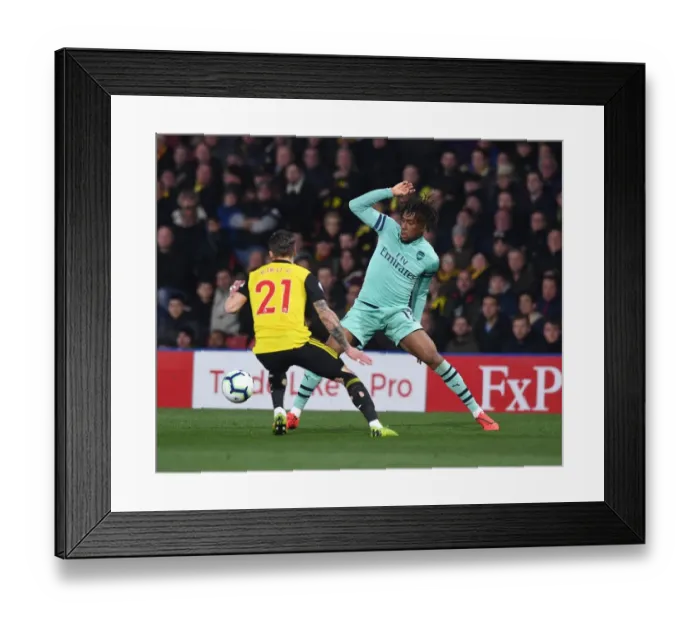 Framed Print : Arsenal's Alex Iwobi Clashes with Watford's Kiko Femenia in Premier League Showdown