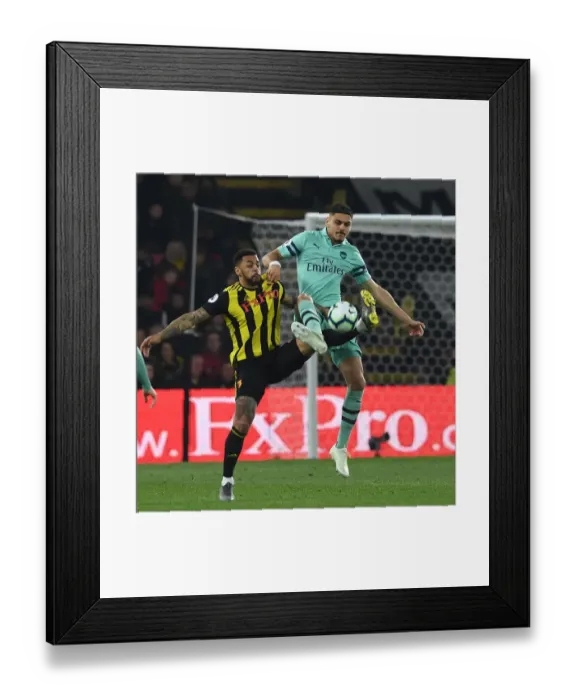 Framed Print : Mavropanos vs. Gray: A Premier League Battle - Arsenal vs. Watford
