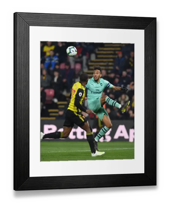 Framed Print : Arsenal's Aubameyang Faces Off Against Watford's Kabasele in Premier League Clash