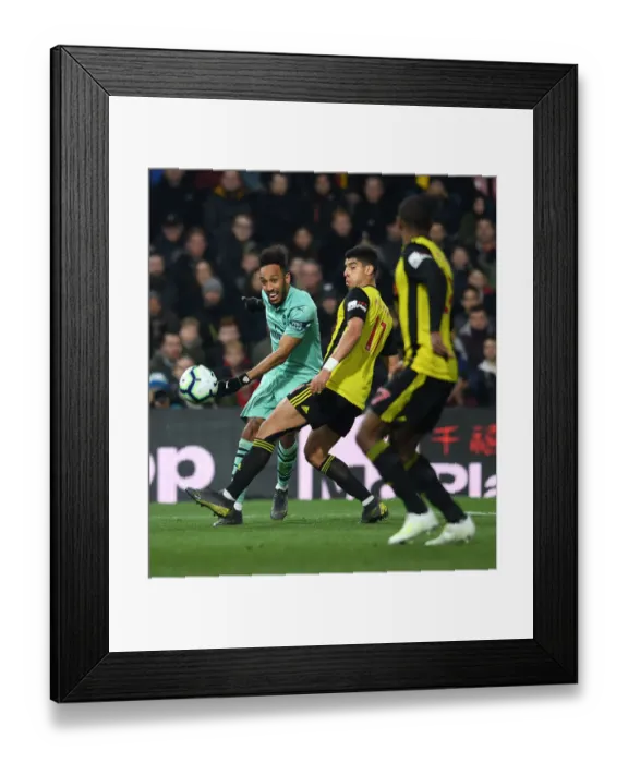 Framed Print : Arsenal's Aubameyang Faces Off Against Watford's Masina in Premier League Clash