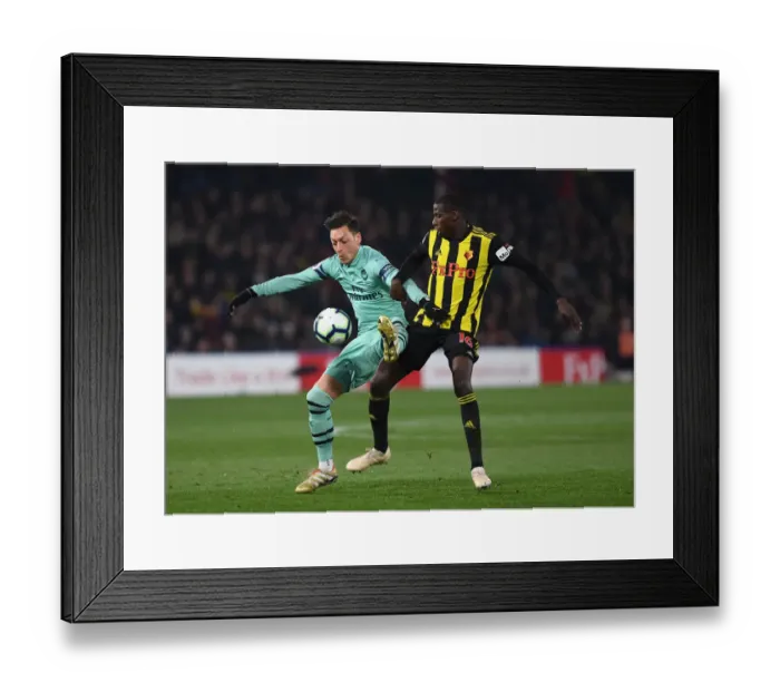 Framed Print : Mesut Ozil vs Abdoulaye Doucoure: Intense Clash in Watford v Arsenal Premier League Match, 2018-19