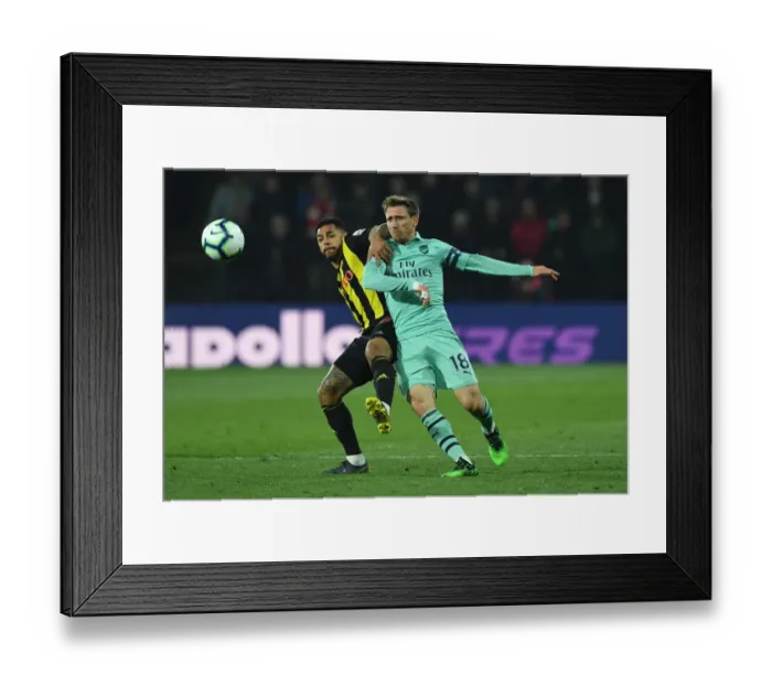 Framed Print : Nacho Monreal vs. Andre Gray: Intense Battle at Vicarage Road - Arsenal vs. Watford, Premier League 2018-19 Framed Print : Nacho Monreal vs. Andre Gray: Intense Battle at Vicarage Road - Arsenal vs. Watford, Premier League 2018-19