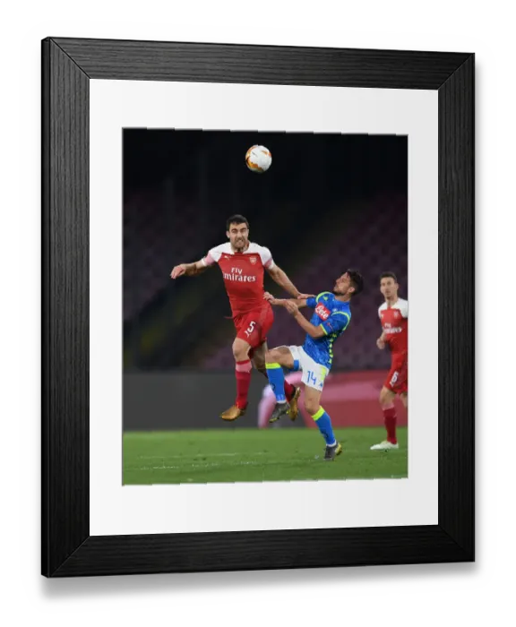 Framed Print : Sokratis vs. Dries Mertens: Heading Battle in Arsenal's Europa League Clash with Napoli Framed Print : Sokratis vs. Dries Mertens: Heading Battle in Arsenal's Europa League Clash with Napoli
