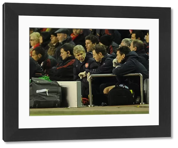 Arsenal manager Arsene Wenger checks the time with physio Colin Lewin. Liverpool 1