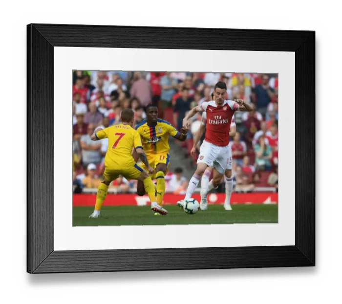 Framed Print : Arsenal's Koscielny vs Zaha: A Premier League Face-Off at Emirates Stadium