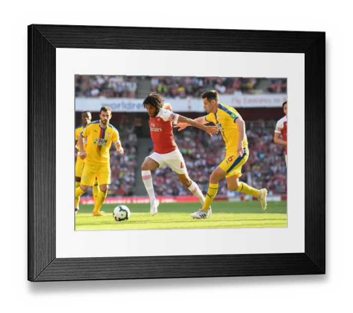 Framed Print : Arsenal's Mohamed Elneny Clashes with Crystal Palace's Scott Dann in Premier League Showdown