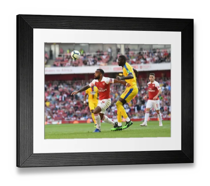 Framed Print : Arsenal's Alexandre Lacazette Faces Off Against Cheikhou Kouyate in Intense Arsenal v Crystal Palace Clash Framed Print : Arsenal's Alexandre Lacazette Faces Off Against Cheikhou Kouyate in Intense Arsenal v Crystal Palace Clash