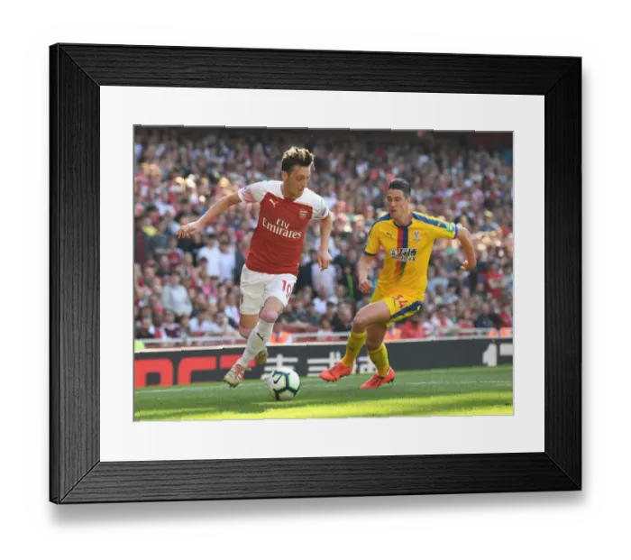 Framed Print : Mesut Ozil vs. Martin Kelly: Intense Moment from Arsenal's Clash with Crystal Palace