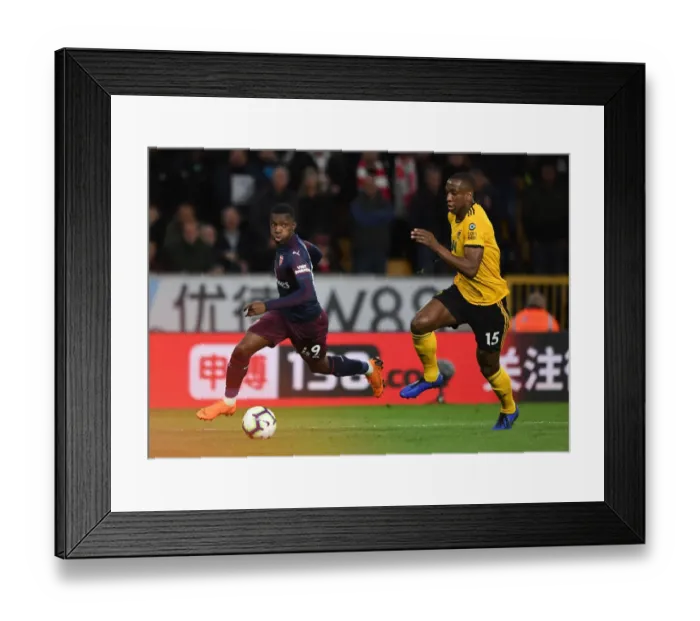 Framed Print : Arsenal's Eddie Nketiah Clashes with Wolves Willy Boly in Intense Premier League Showdown (2018-19) Framed Print : Arsenal's Eddie Nketiah Clashes with Wolves Willy Boly in Intense Premier League Showdown (2018-19)