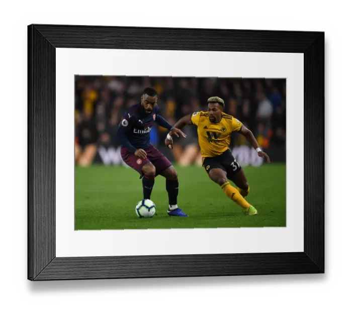 Framed Print : Lacazette vs Traore: Wolverhampton Wanderers vs Arsenal FC, Premier League Showdown (2018-19)