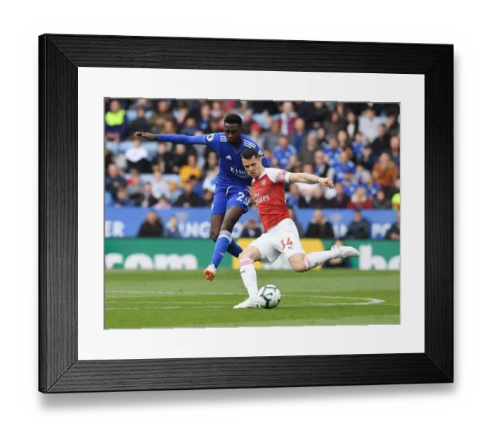 Framed Print : Xhaka's Powerful Overtake: Arsenal's Thrilling Victory over Leicester City (2018-19)