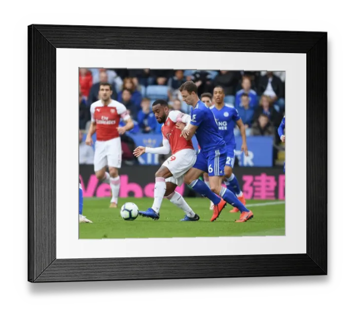 Framed Print : Leicester City vs. Arsenal: Lacazette vs. Evans Clash in Premier League Showdown Framed Print : Leicester City vs. Arsenal: Lacazette vs. Evans Clash in Premier League Showdown