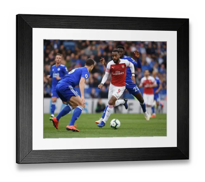 Framed Print : Leicester vs Arsenal: Lacazette Faces Off Against Evans and Ndidi