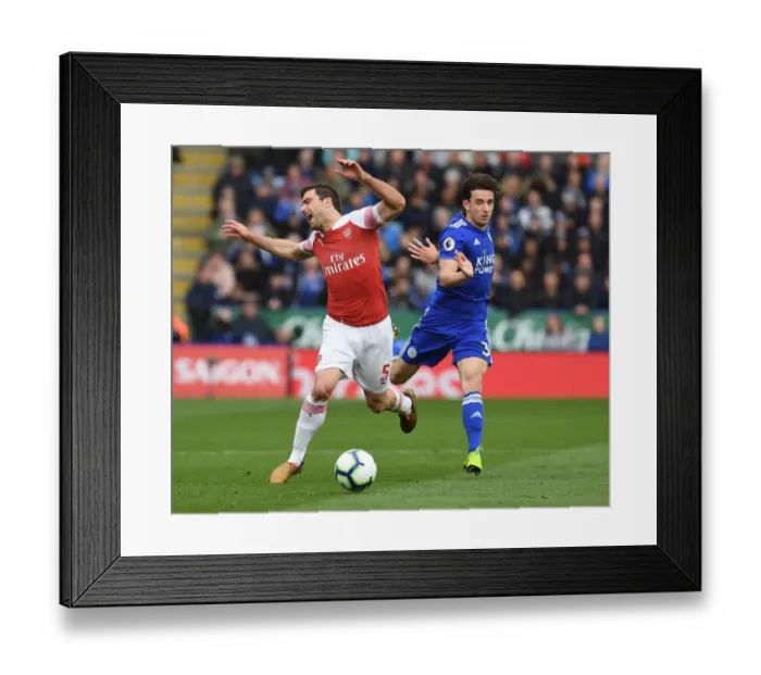 Framed Print : Arsenal's Sead Kolasinac Tripped by Leicester's Ben Chilwell in Intense Premier League Clash