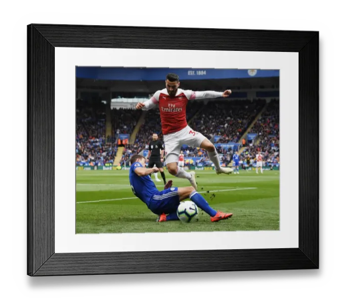 Framed Print : Clash at The King Power: Evans vs. Kolasinac - A Premier League Battle Framed Print : Clash at The King Power: Evans vs. Kolasinac - A Premier League Battle