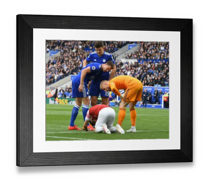 Framed Print : Leicester vs Arsenal: Evans and Schmeichel Over Torreira's Injury (2018-19) Framed Print : Leicester vs Arsenal: Evans and Schmeichel Over Torreira's Injury (2018-19)