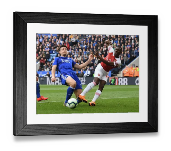 Framed Print : Nketiah vs. Maguire: A Premier League Battle at The King Power Framed Print : Nketiah vs. Maguire: A Premier League Battle at The King Power