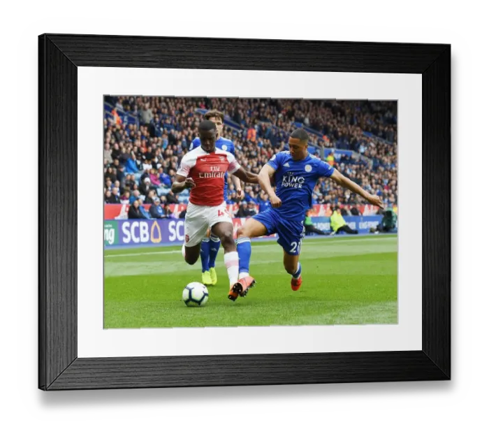 Framed Print : Nketiah vs Tielemans: A Premier League Showdown at The King Power Stadium Framed Print : Nketiah vs Tielemans: A Premier League Showdown at The King Power Stadium
