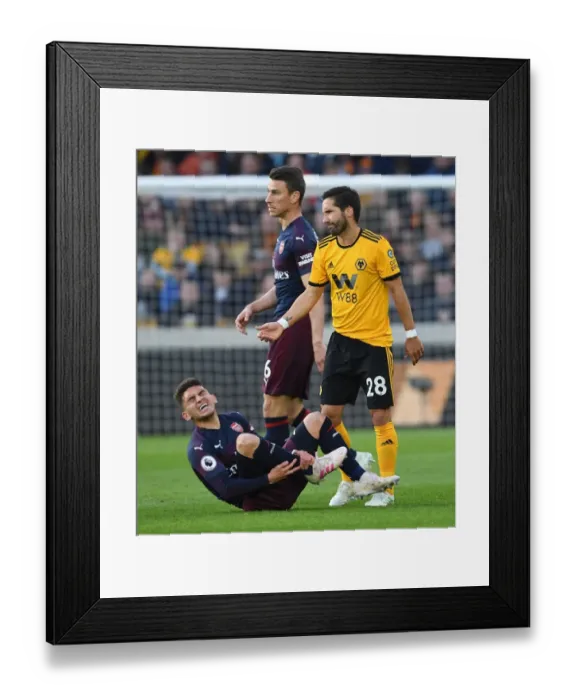 Framed Print : Torreira in Pain: Wolverhampton's Moutinho Inflicts Injury on Arsenal Midfielder