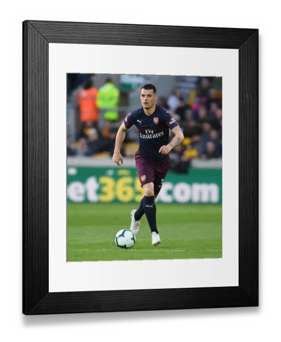 Framed Print : Granit Xhaka in Action: Wolverhampton Wanderers vs Arsenal FC, Premier League 2018-19