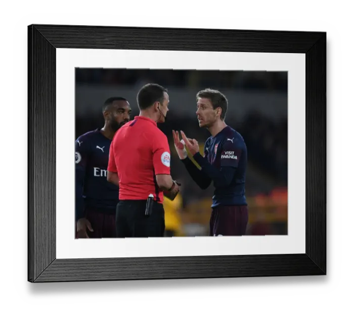 Framed Print : Nacho Monreal Contests Referees Call in Intense Wolverhampton Wanderers vs. Arsenal FC Premier League Clash