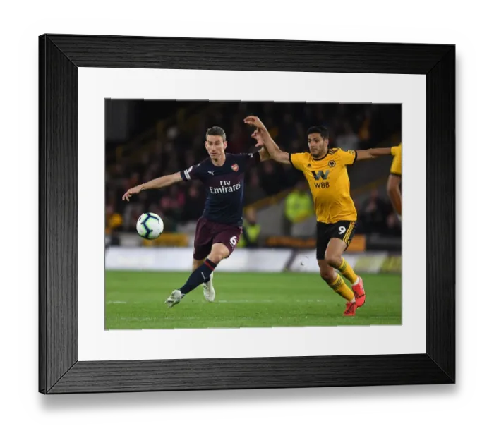 Framed Print : Koscielny vs. Jimenez: Intense Battle in Wolverhampton Wanderers vs. Arsenal FC Premier League Clash Framed Print : Koscielny vs. Jimenez: Intense Battle in Wolverhampton Wanderers vs. Arsenal FC Premier League Clash