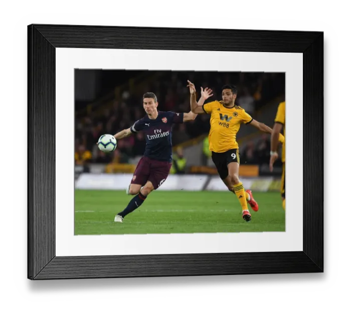 Framed Print : Clash at Molineux: Koscielny vs. Jimenez in Premier League Showdown (Wolverhampton Wanderers vs. Arsenal FC, 2018-19)