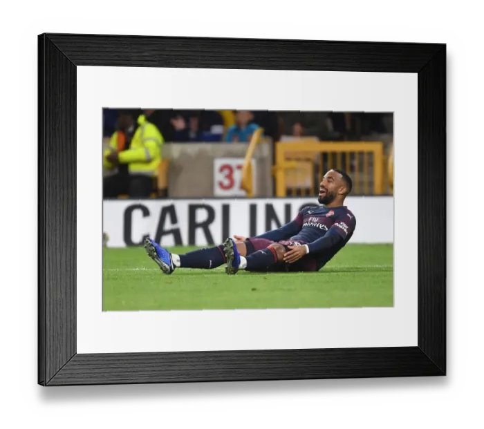 Framed Print : Arsenal's Alex Lacazette Faces Off Against Wolverhampton Wanderers in Premier League Clash Framed Print : Arsenal's Alex Lacazette Faces Off Against Wolverhampton Wanderers in Premier League Clash