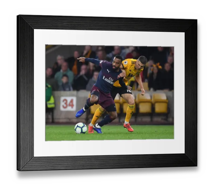 Framed Print : Arsenal's Lacazette Clashes with Wolverhampton's Coady in Premier League Showdown Framed Print : Arsenal's Lacazette Clashes with Wolverhampton's Coady in Premier League Showdown