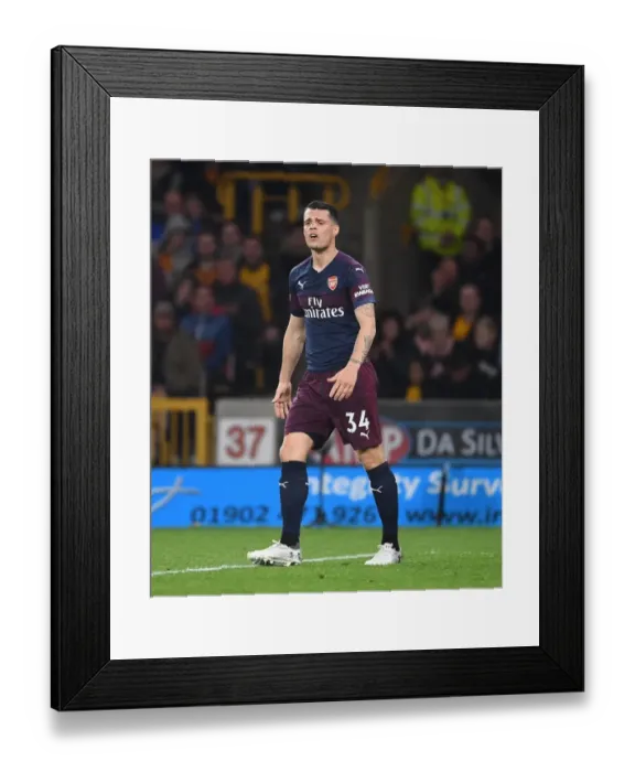 Framed Print : Granit Xhaka: Arsenal's Midfield Maestro in Action vs. Wolverhampton Wanderers Framed Print : Granit Xhaka: Arsenal's Midfield Maestro in Action vs. Wolverhampton Wanderers
