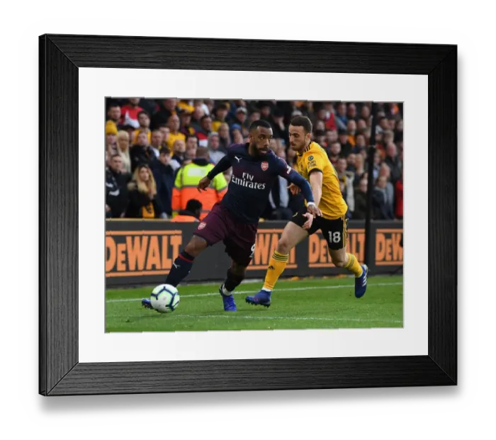 Framed Print : Lacazette vs. Jota: Intense Battle at Molineux - Wolverhampton Wanderers vs. Arsenal FC, Premier League 2018-19