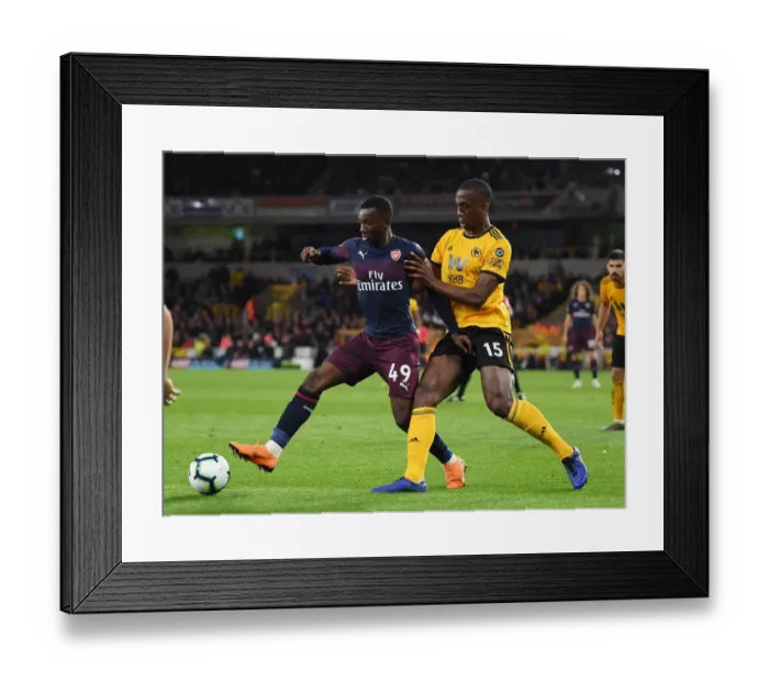 Framed Print : Arsenal's Eddie Nketiah Battles Willy Boly in Intense Wolverhampton Wanderers Clash