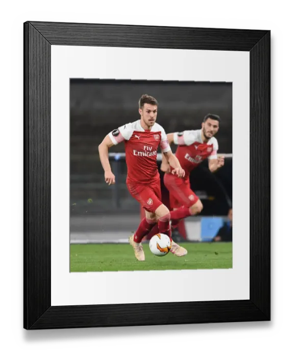 Framed Print : Arsenal's Aaron Ramsey Goes Head-to-Head with Napoli in Europa League Quarterfinal Showdown Framed Print : Arsenal's Aaron Ramsey Goes Head-to-Head with Napoli in Europa League Quarterfinal Showdown