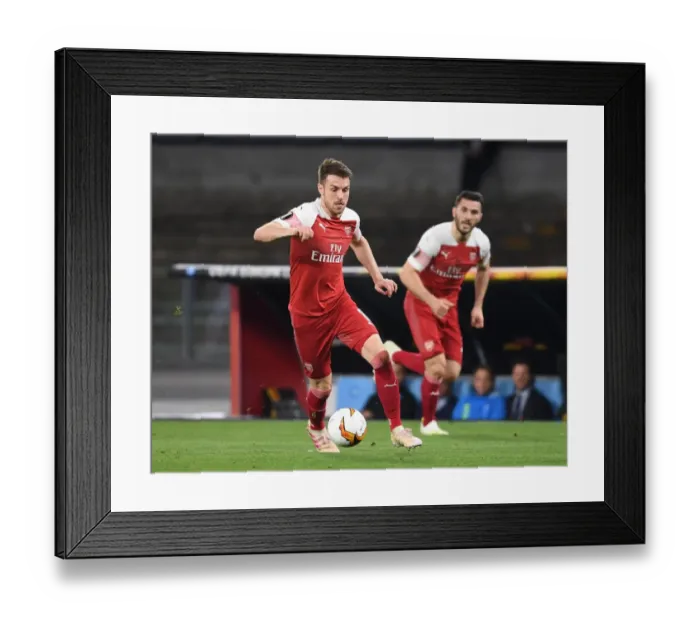 Framed Print : Arsenal's Aaron Ramsey Faces Off Against Napoli in Europa League Quarterfinals