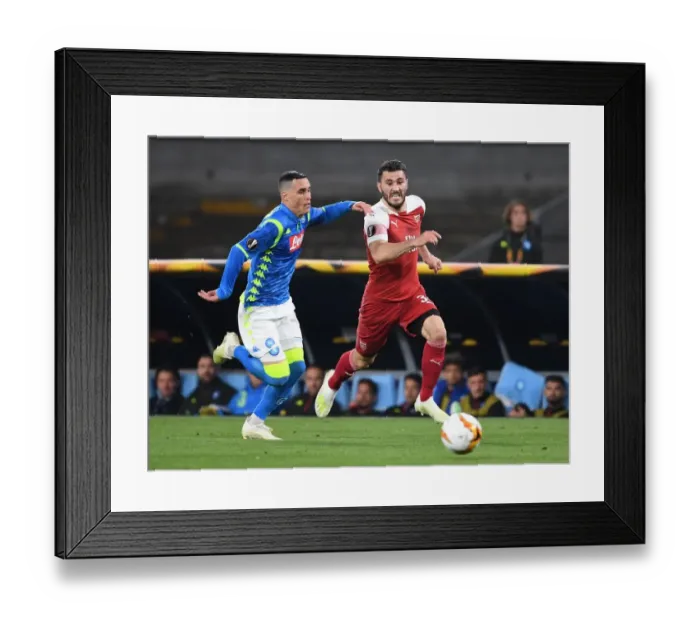 Framed Print : Arsenal's Sead Kolasinac Overpowers Jose Callejon in Europa League Quarterfinal Clash