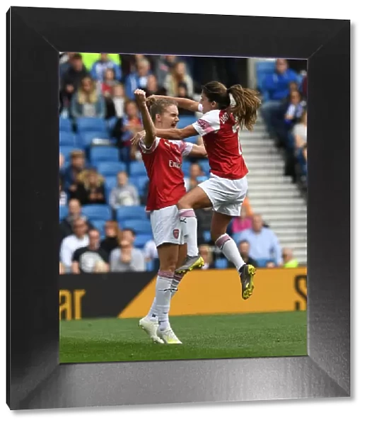 Miedema and van de Donk Celebrate Arsenal's Winning Goal vs. Brighton Women